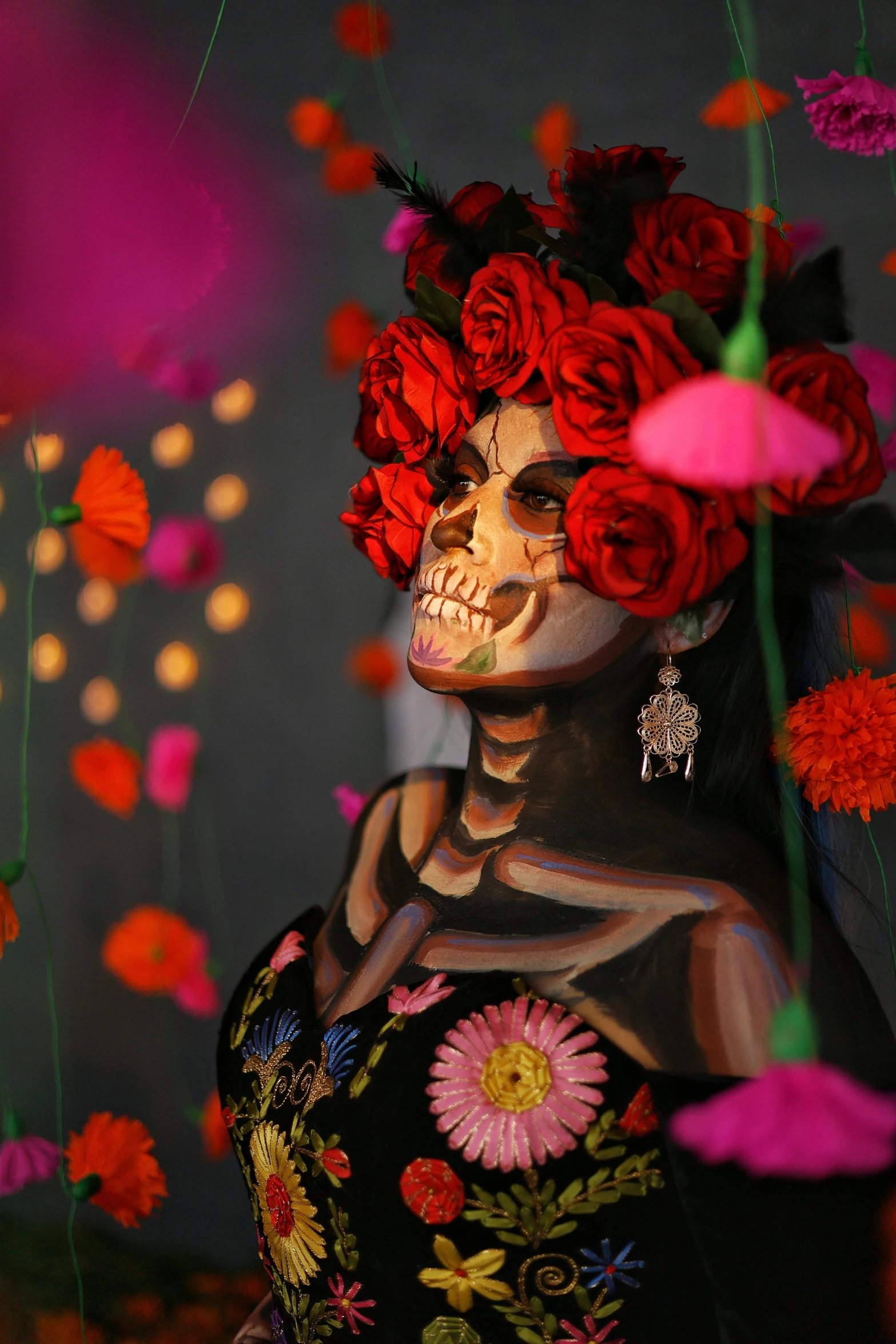 a skeleton with roses on its head surrounded by flowers