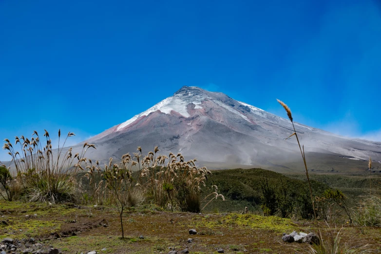 a large white volcano sitting on the top of a mountain