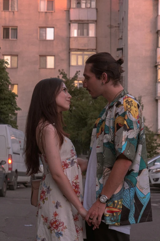 a man and a woman walking through an intersection