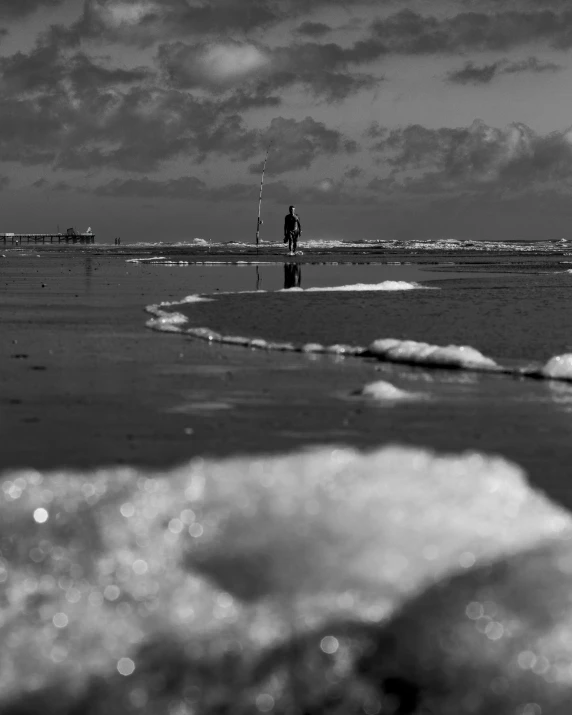 a black and white po with the tide coming in