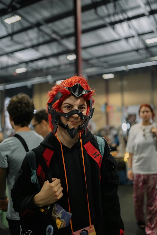 young man dressed in motorcycle gear with helmet