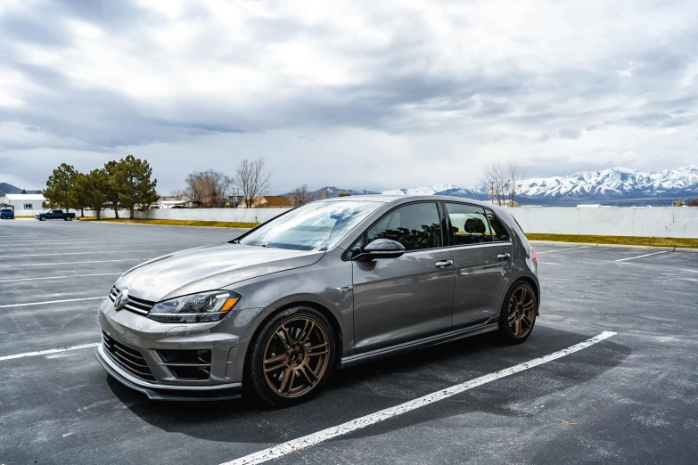 a silver car is parked in the parking lot