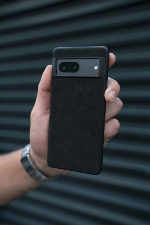 a person holds up a case that fits the back of their samsung phone