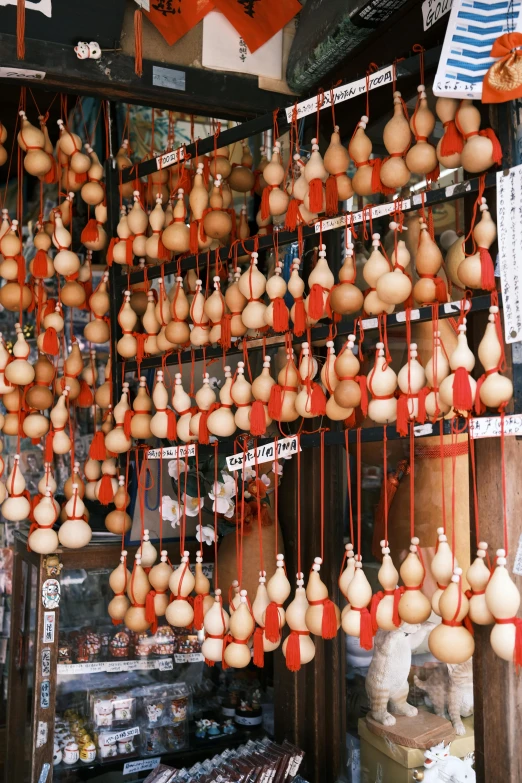 a display of several large round hanging objects in a market