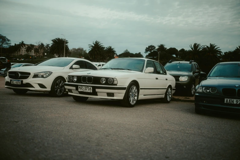 three cars parked together in a parking lot