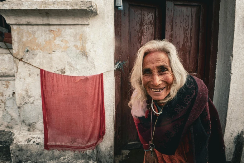 a woman who is standing next to two door