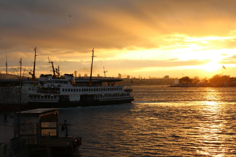 a ferry sitting in front of a large body of water