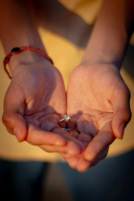 a person holding their hands in small circles