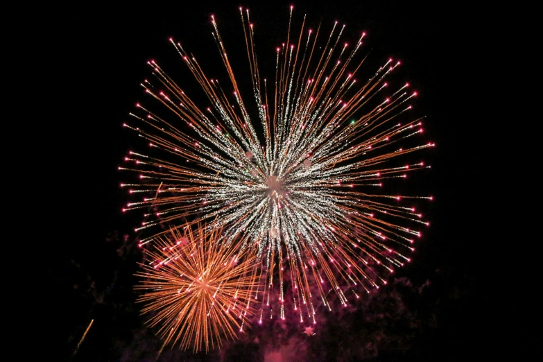 a large fireworks display with lights and fireworks