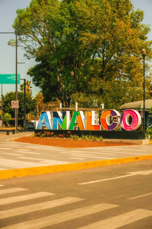 the entrance to an animal sanctuary with a large colorful sign