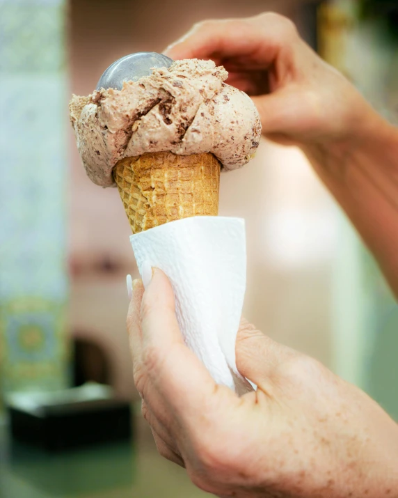 an ice cream cone sitting on top of paper