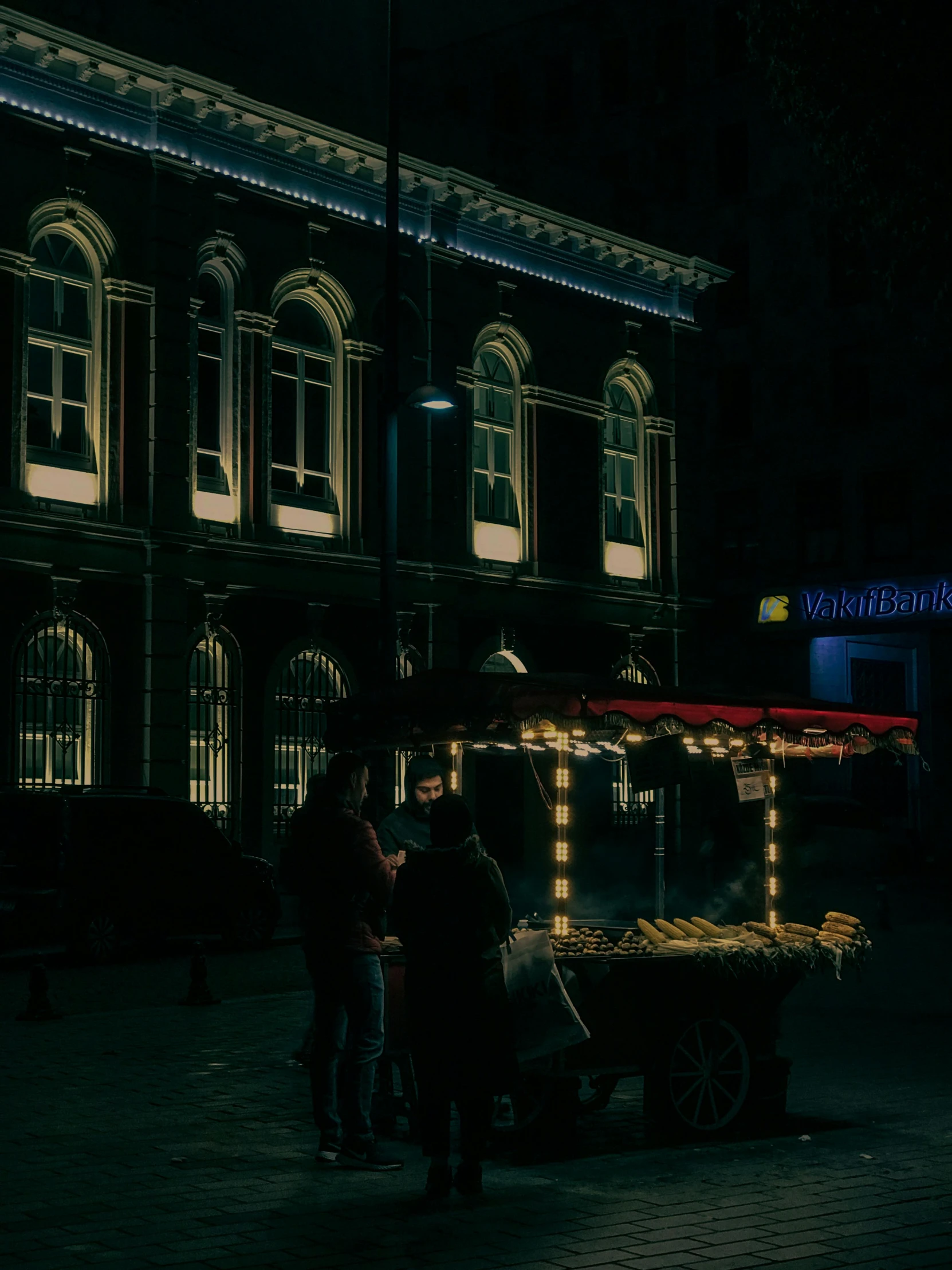 the three people are standing outside of the horse drawn carriage