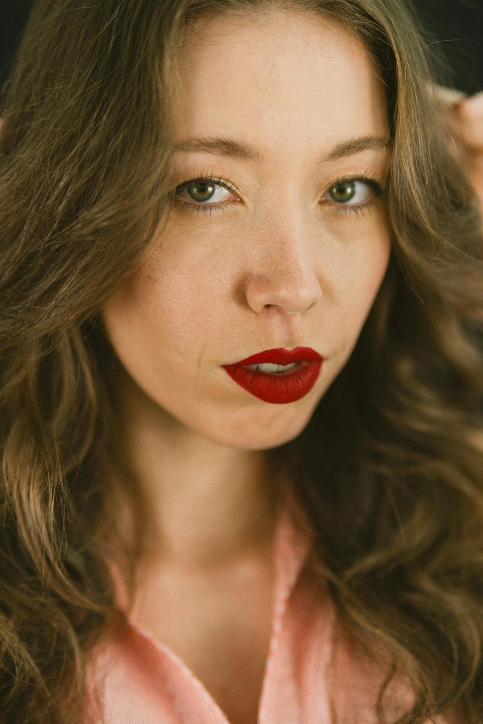 a woman with red lipstick on her face