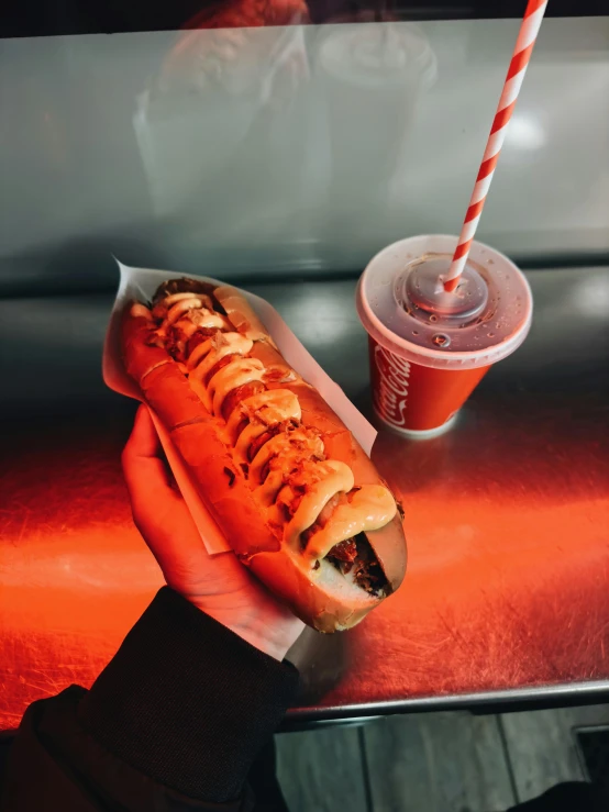 a  dog sitting next to a drink