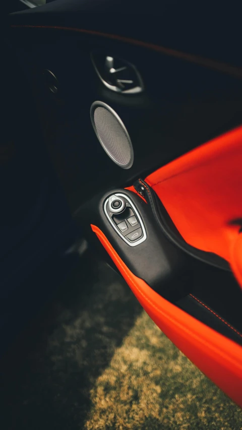 the inside of a red and black sports car