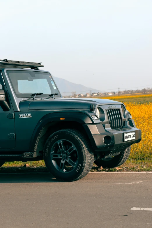 a jeep sits on the side of the road