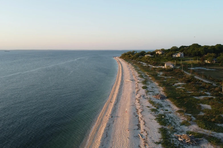 beach area next to large body of water and shore line