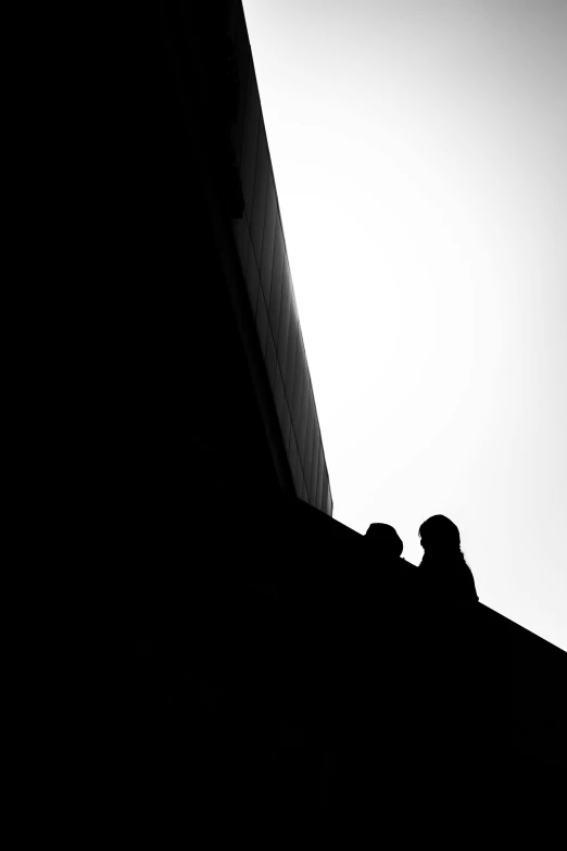 black and white po of people on the top of a building