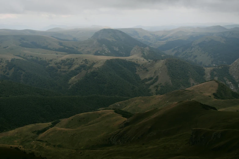 green hills on a cloudy day with a sky background