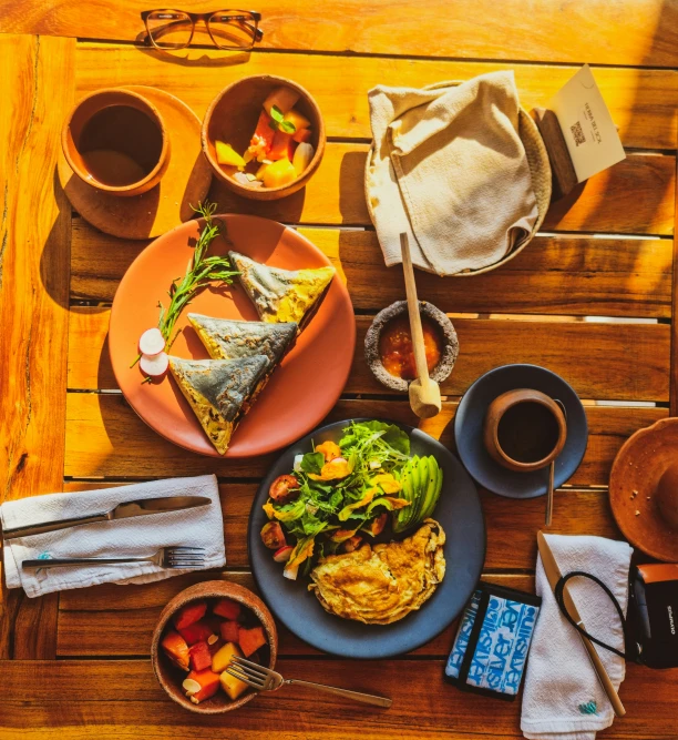 a meal sits on a wooden table