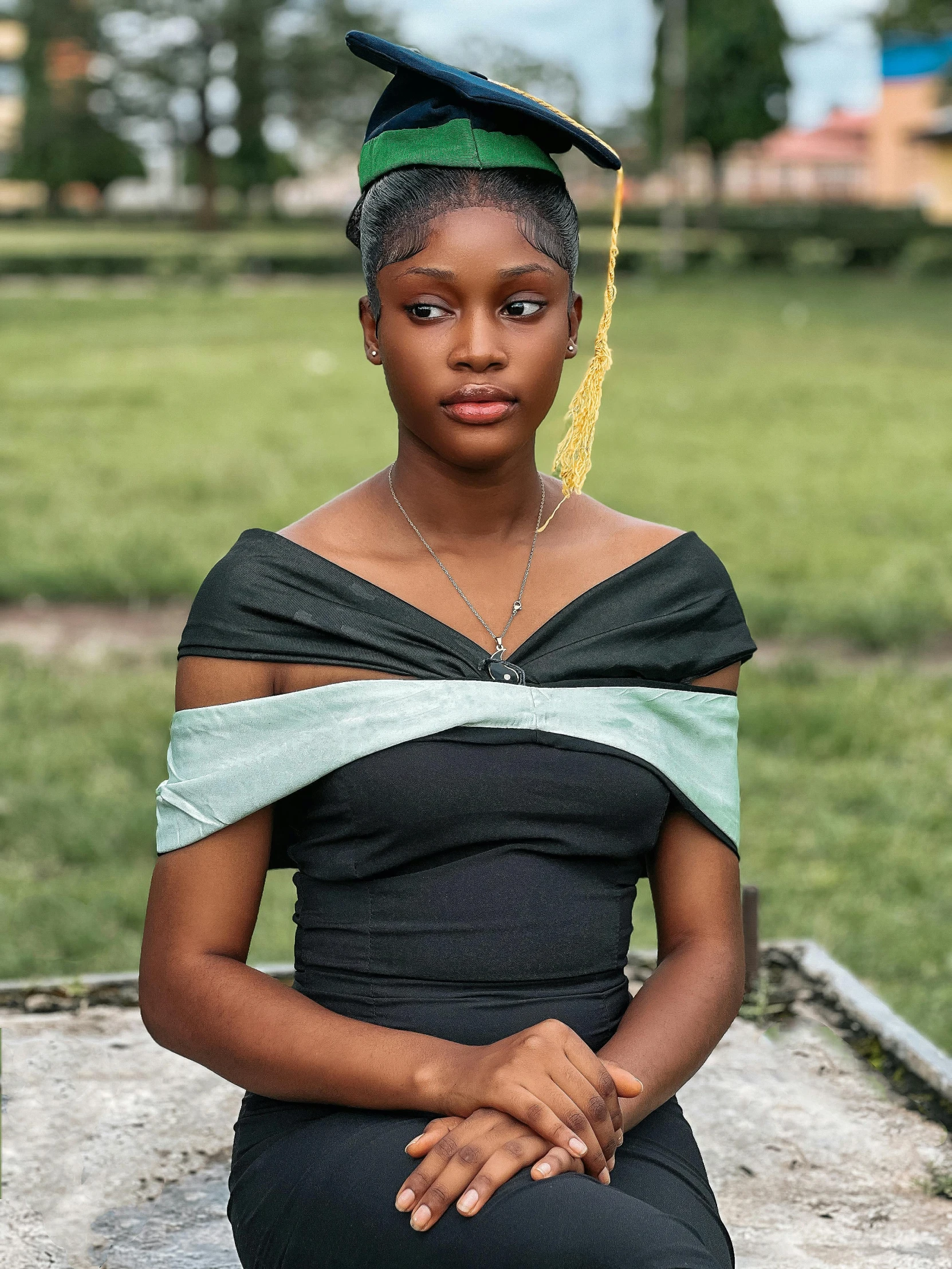 an african american woman wearing a graduation cap