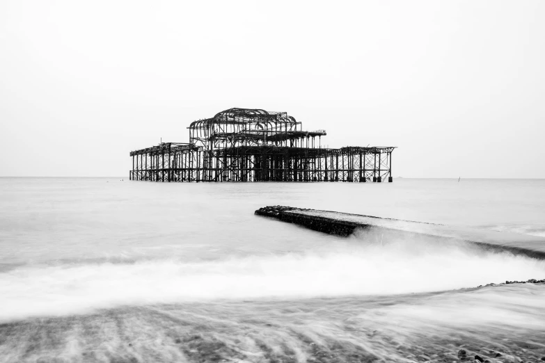 a po taken in black and white shows the remains of a seawall