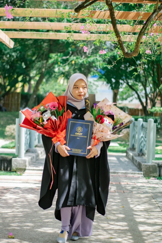 an asian woman holding flowers under a canopy