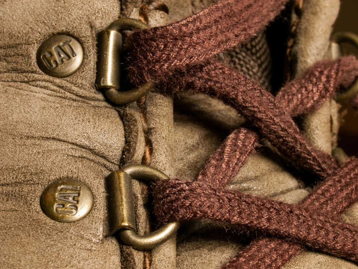 a close up of a person's shoes, showing the laces