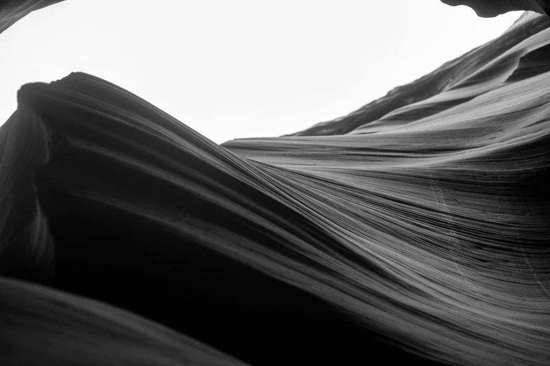 the face of a man looking out of a rock