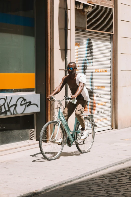 a man on a bike with graffiti on it