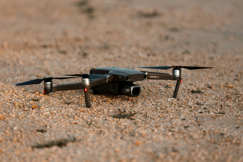 a black remote control flying in the air