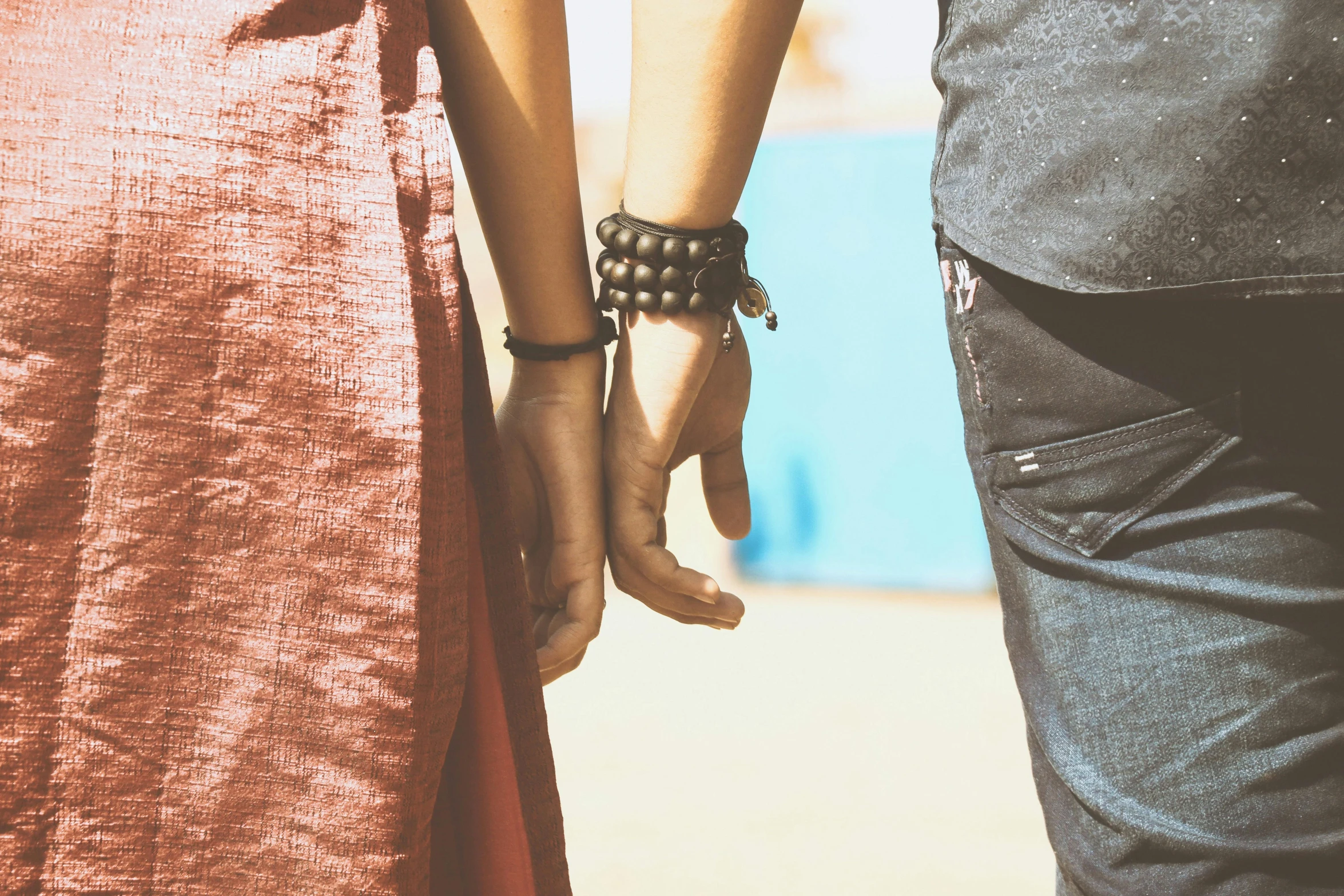 two people holding hands near each other