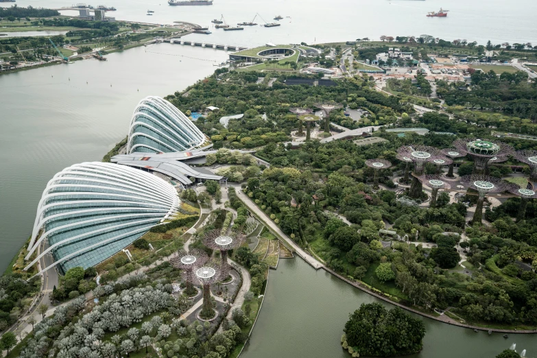 an aerial s of gardens by the bay and a bay filled with boats