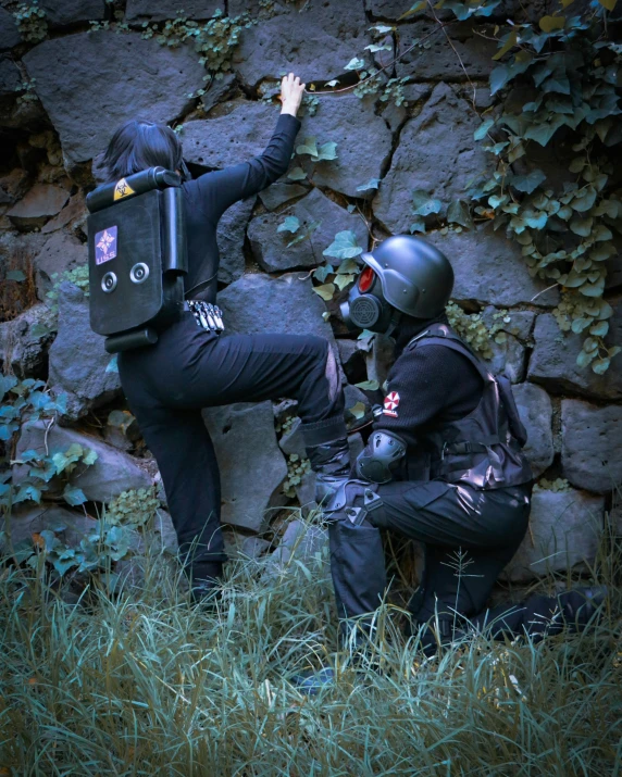 two people in costumes are in front of a rock