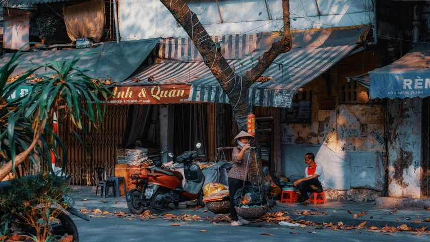 people on motorcycles and chairs outside of a building