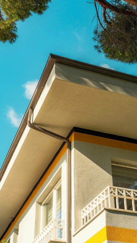 a view of the balcony of a building from the side