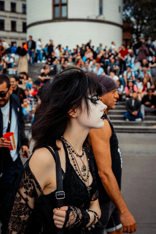 people dressed in black walking in the street