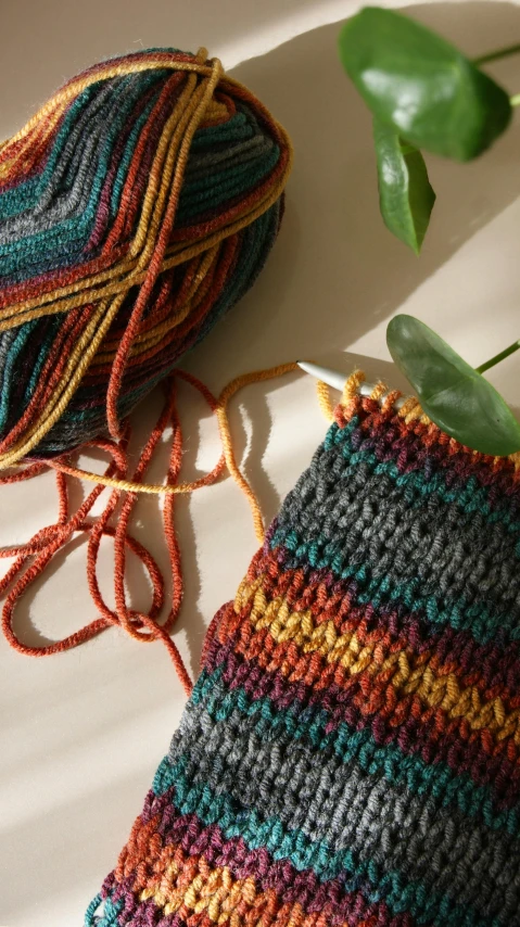 crochet string laying on top of a knitting project