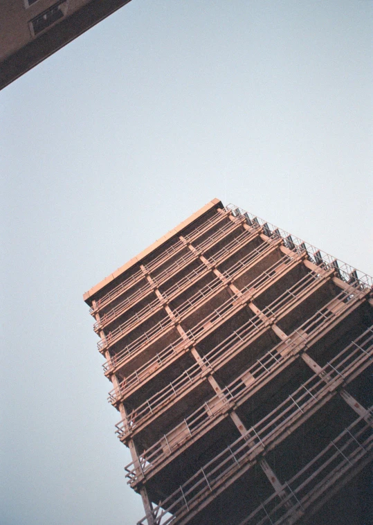 a very tall building under construction with scaffolding