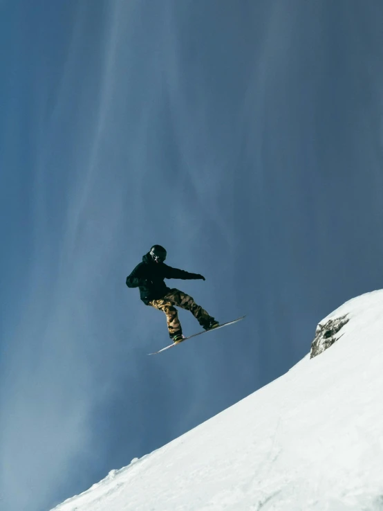 a man flying through the air while riding skis