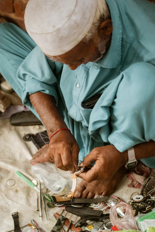 older woman in blue shirt  pieces on the table