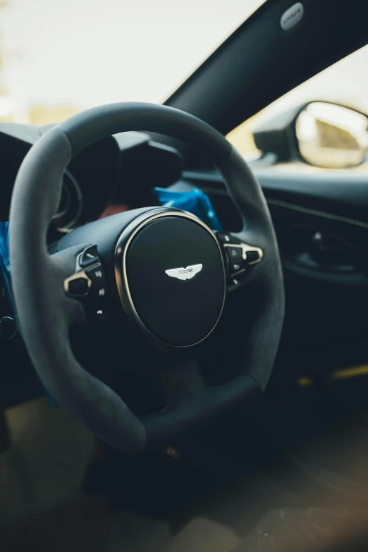 the interior of a car with a steering wheel and instrument s