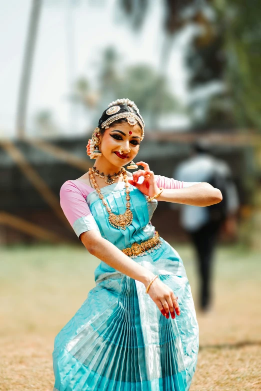 an indian woman performing an old classical dance