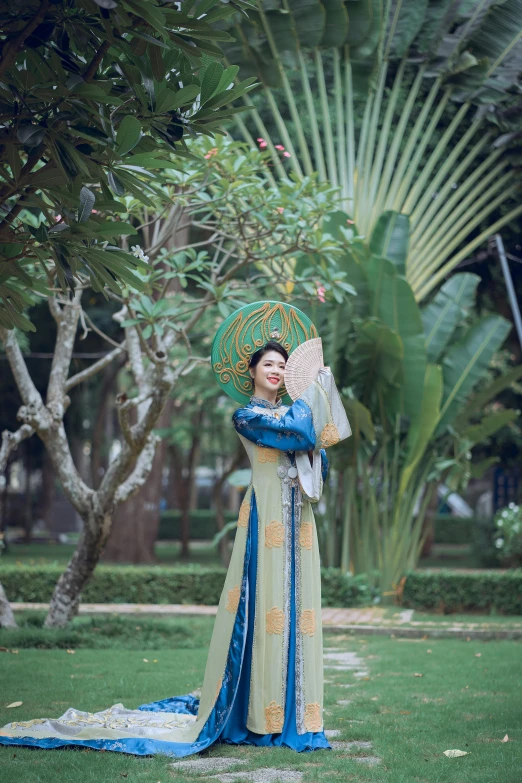 the oriental woman is posing with her hand fan