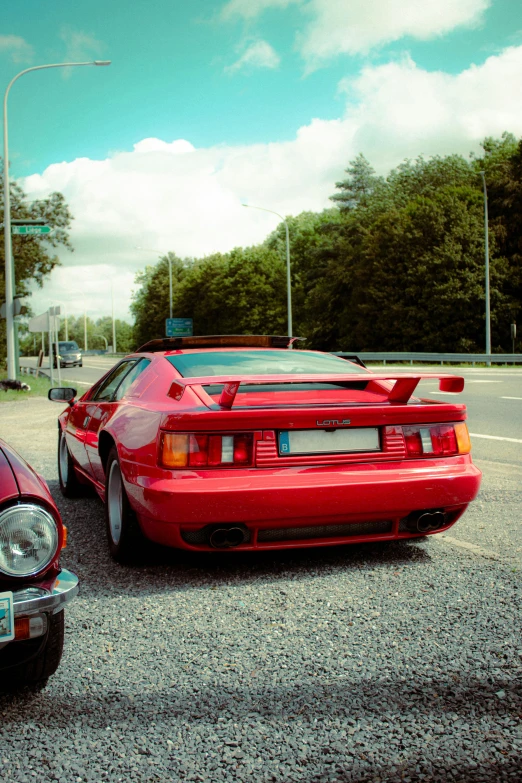 two red sports cars parked next to each other