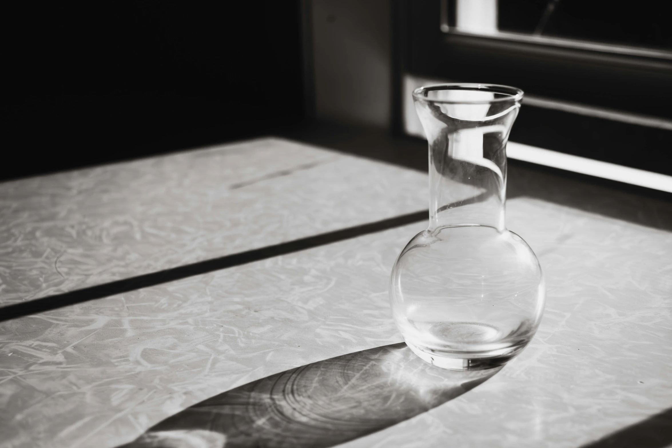 a vase and a knife are on a table