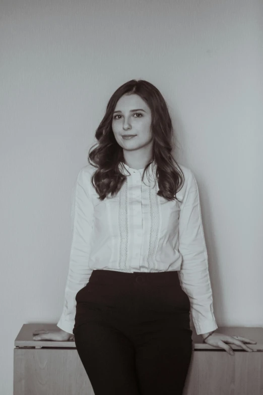 woman sitting on wooden shelf with long hair