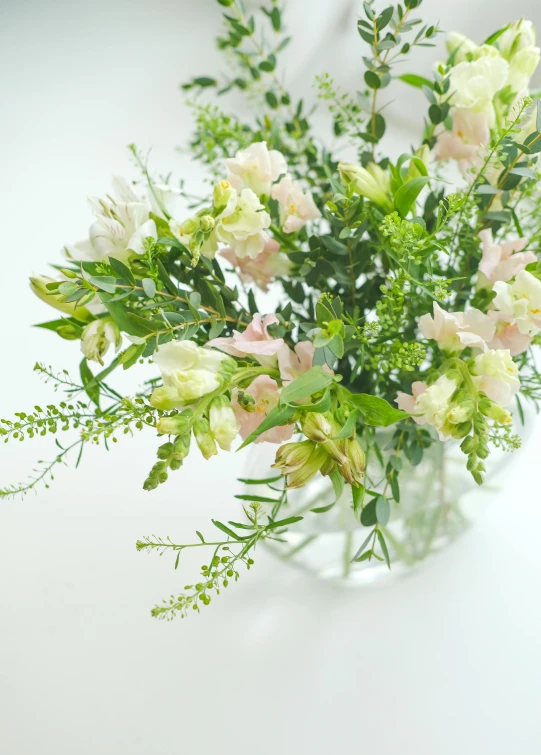 a bouquet of flowers in a clear vase