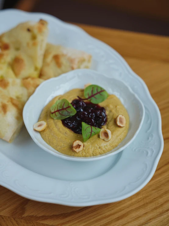 food items in a bowl sitting on a plate