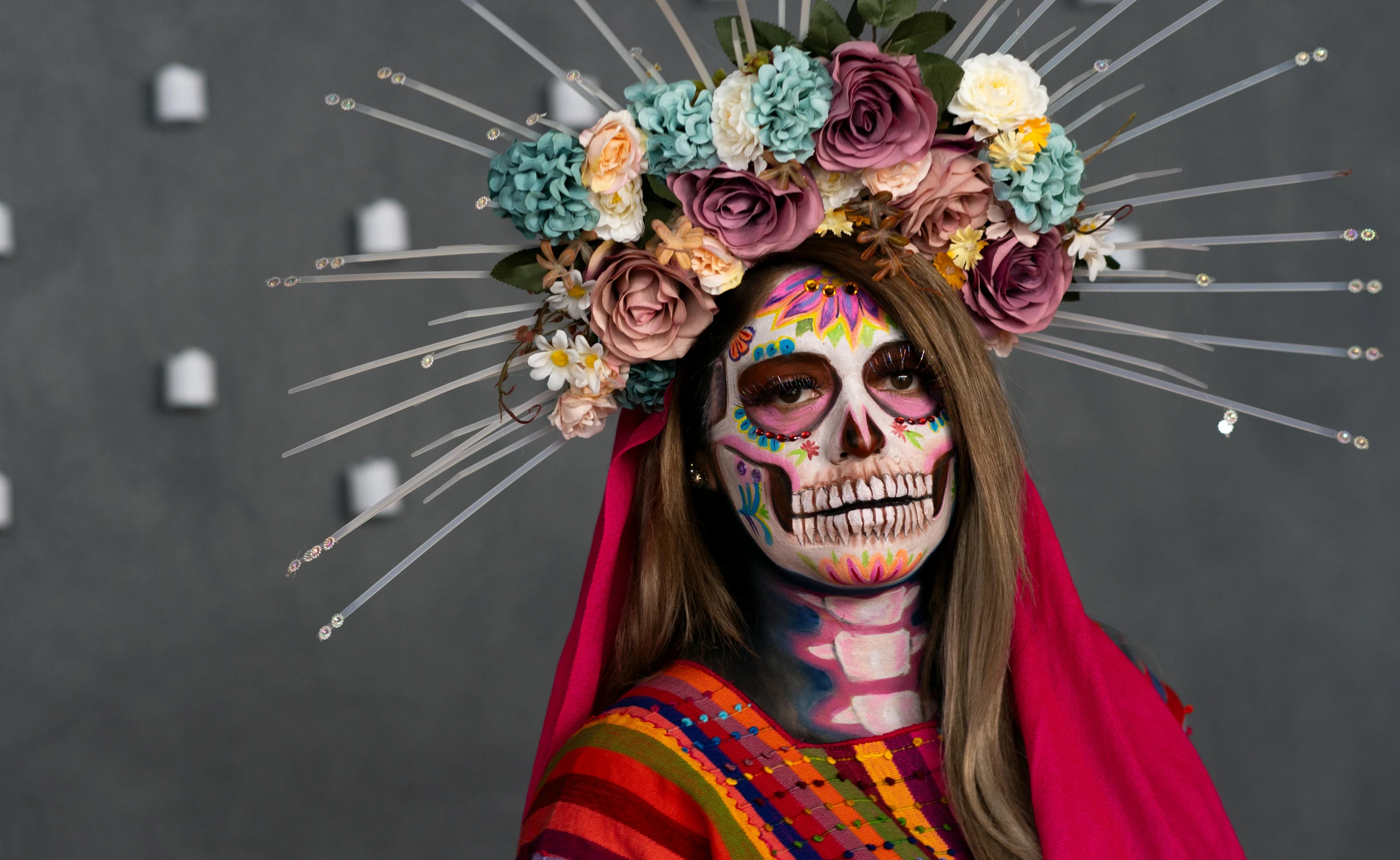 woman with flowered day of the dead make up